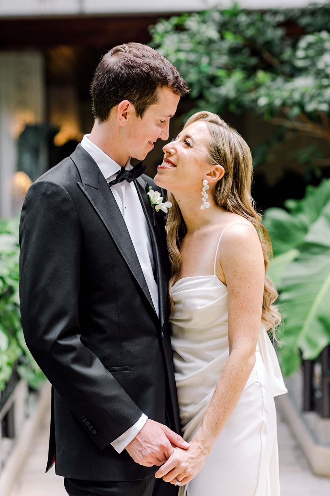 Bride and groom after first look on wedding day at Mayfair House Hotel & Garden in Coconut Grove, Miami, Florida.