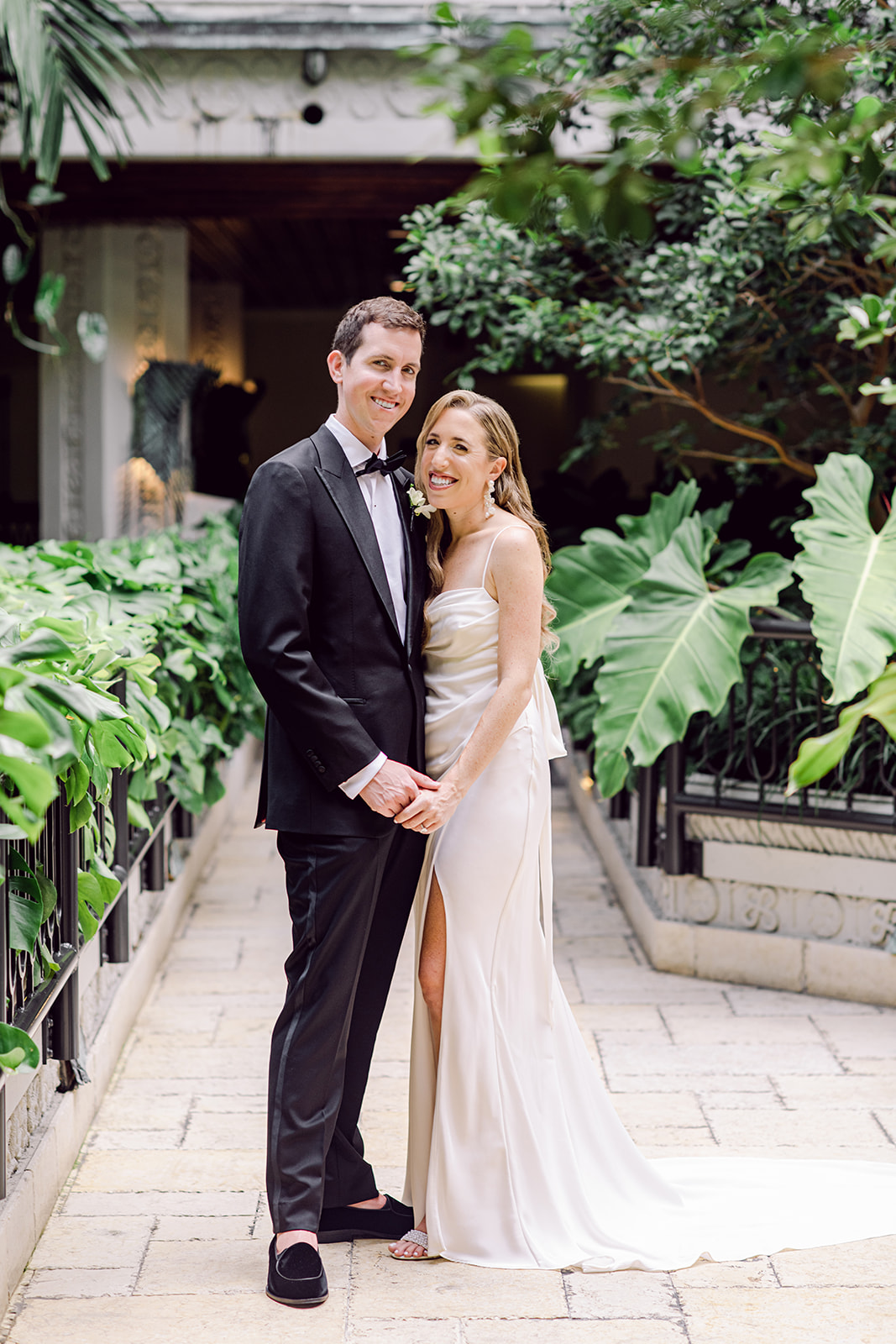 Bride & groom portrait after first look at Mayfair House Hotel & Garden in Miami on wedding day.