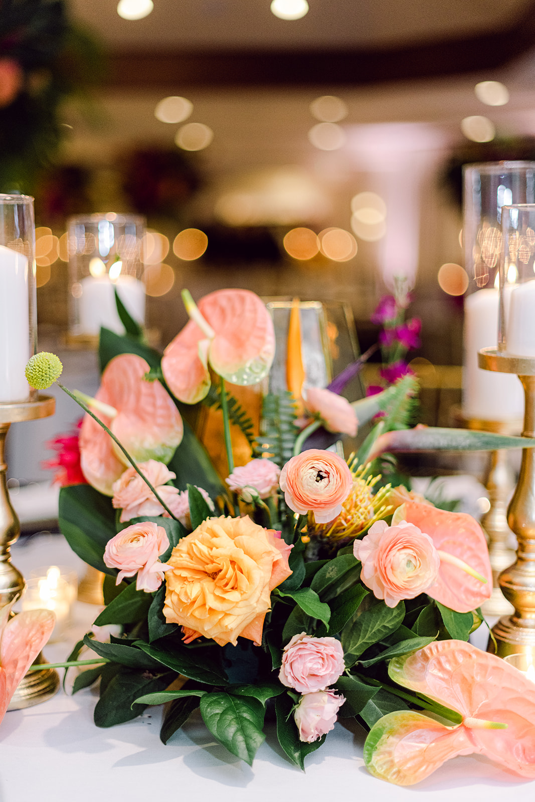 Close up table decor detail of florals for reception at Mayfair House Hotel & Garden in Miami on wedding day.
