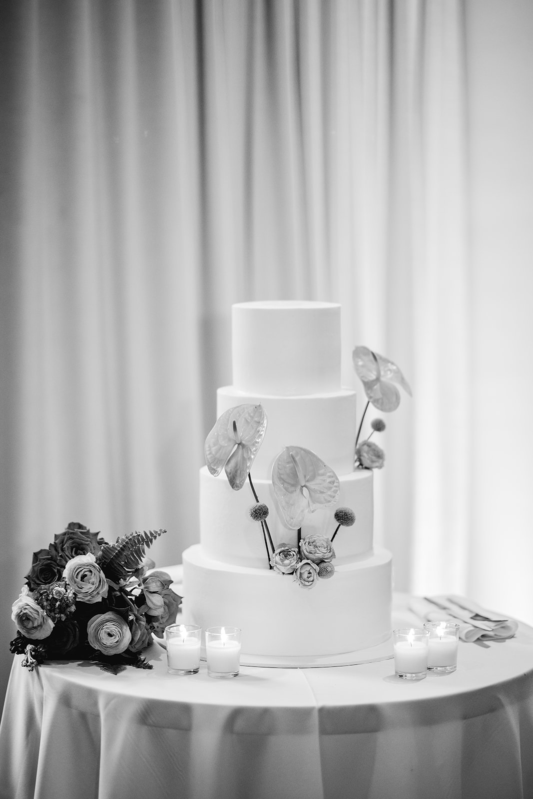 Black and white detail of wedding cake at reception hall at Mayfair House Hotel & Garden in Miami on wedding day.