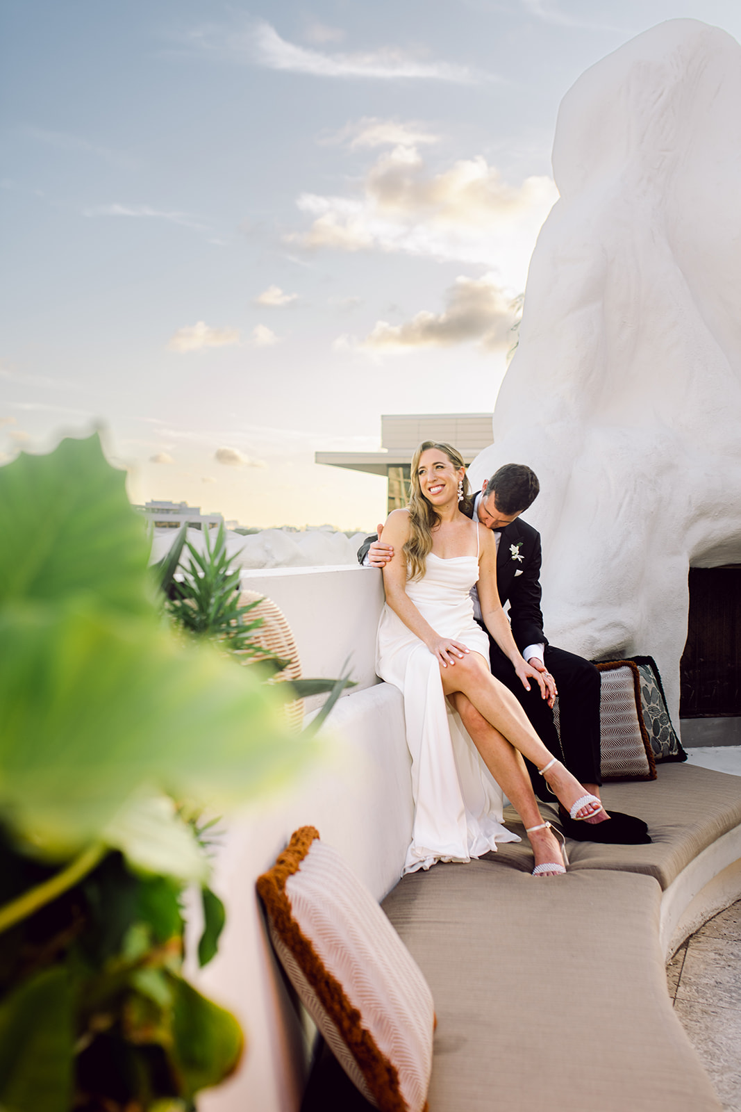 Newlywed golden hour session couple at fireplace on rooftop of Mayfair House Hotel & Garden in Miami on wedding day.
