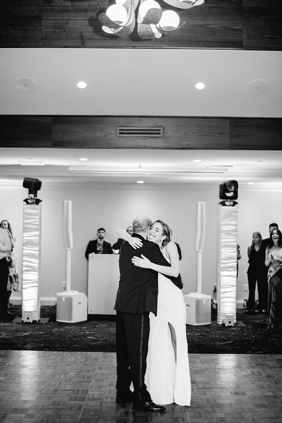 Black and white father daughter dance at reception at Mayfair House Hotel & Garden, Miami on wedding day.