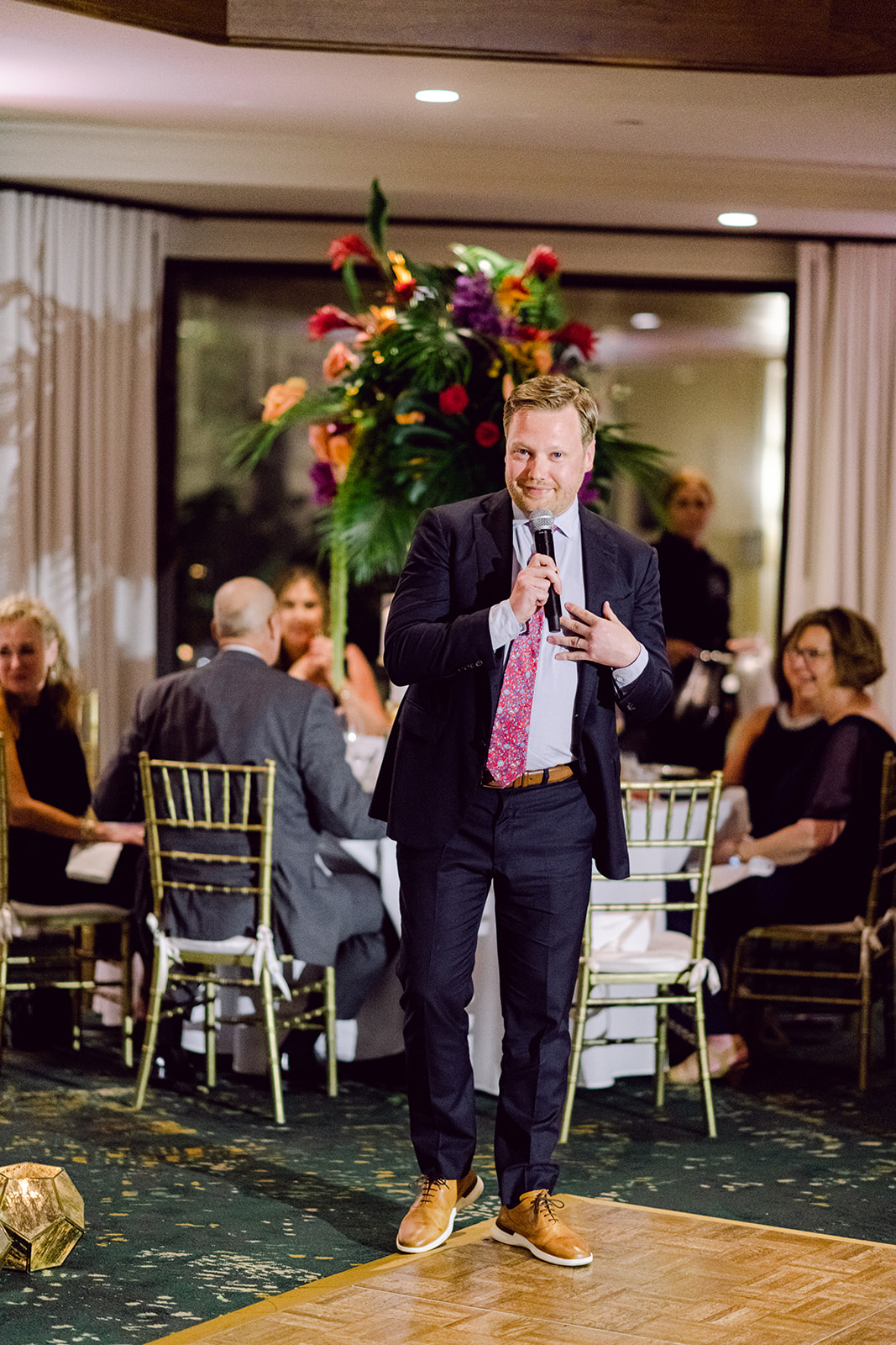 Best man speech and toast at reception hall of Mayfair House Hotel & Garden in Miami on wedding day.