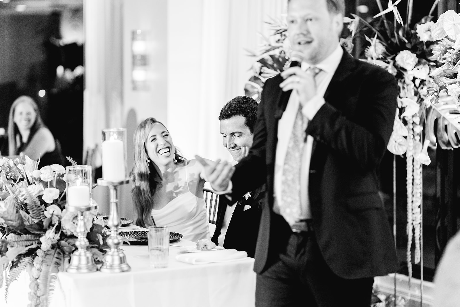 Black and white best man speech and toast at reception hall of Mayfair House Hotel & Garden in Miami on wedding day.