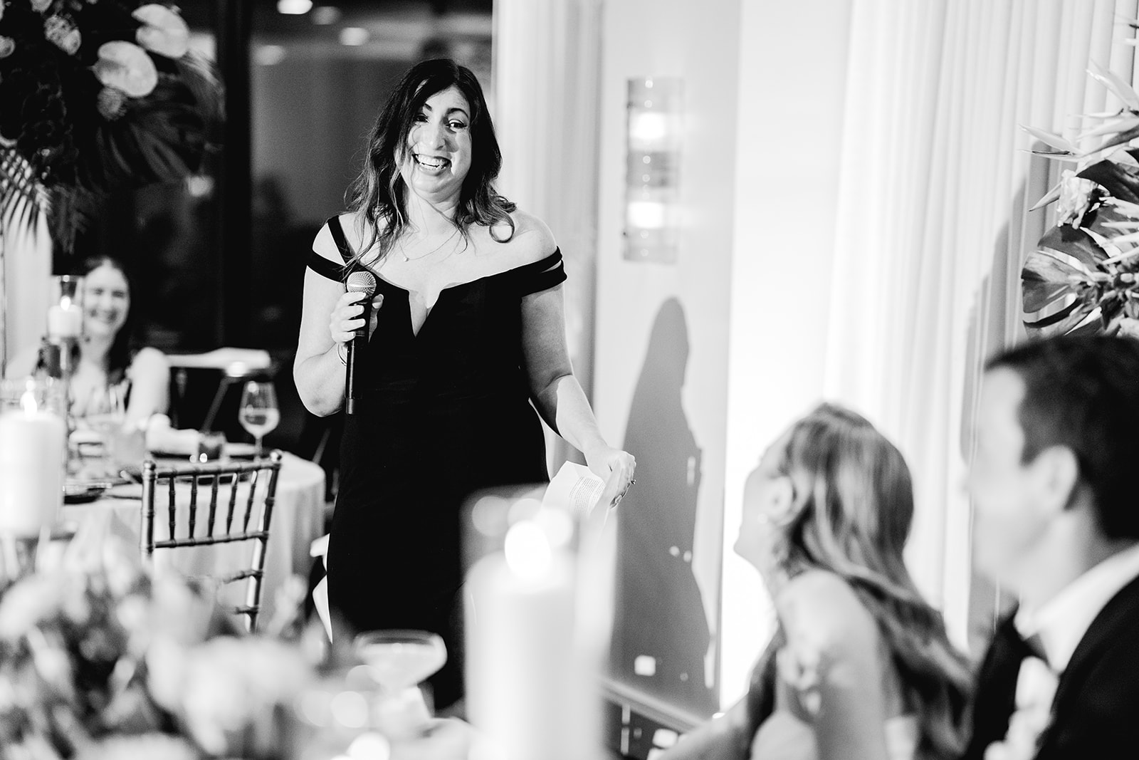 Black and white maid of honor speech and toast at reception hall of Mayfair House Hotel & Garden, Miami on wedding day.