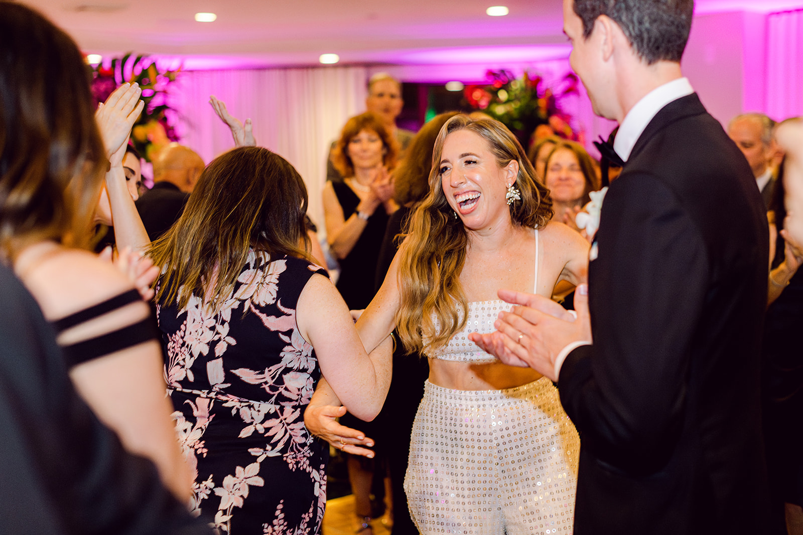 Candids of bride and groom dancing at reception of Mayfair House Hotel & Garden, Miami on wedding day.