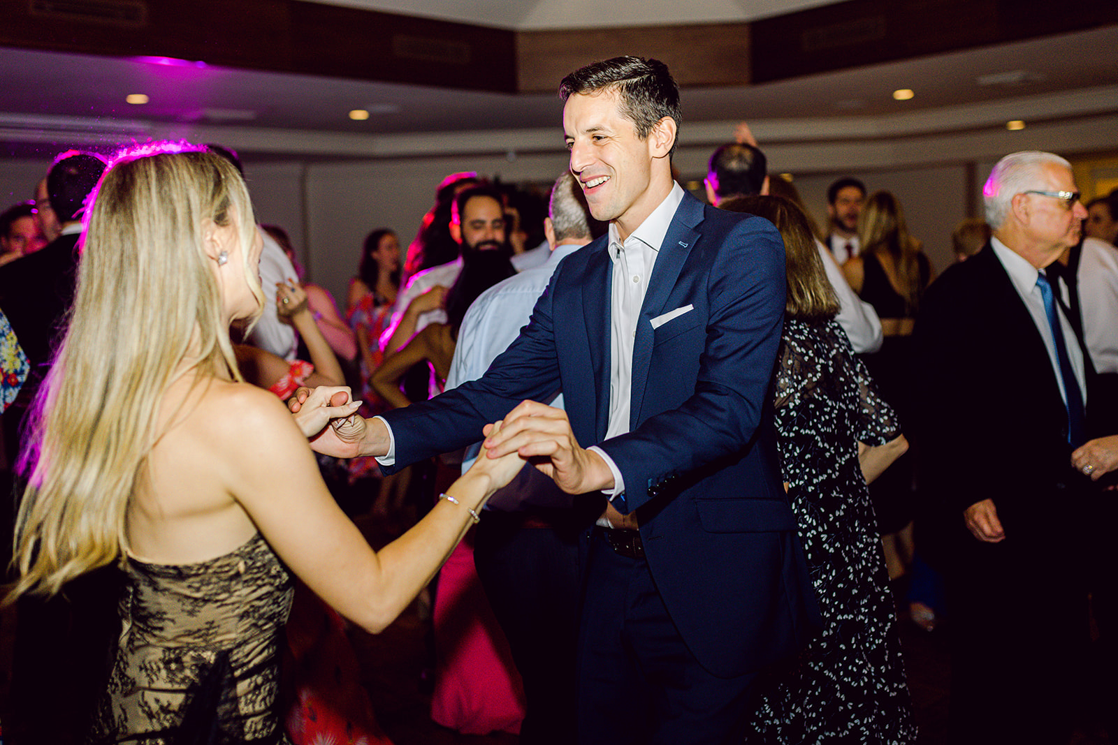 Candids of guests dancing at reception of Mayfair House Hotel & Garden, Miami on wedding day.