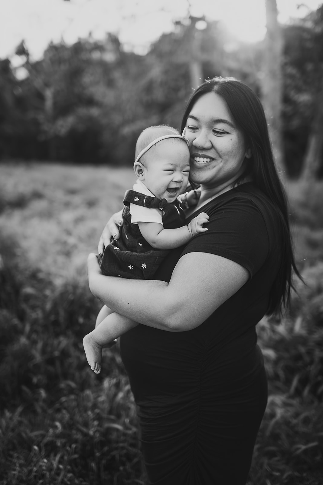 Black and white photo of mom and her beautiful baby smiling at Marian Bear Park San Diego