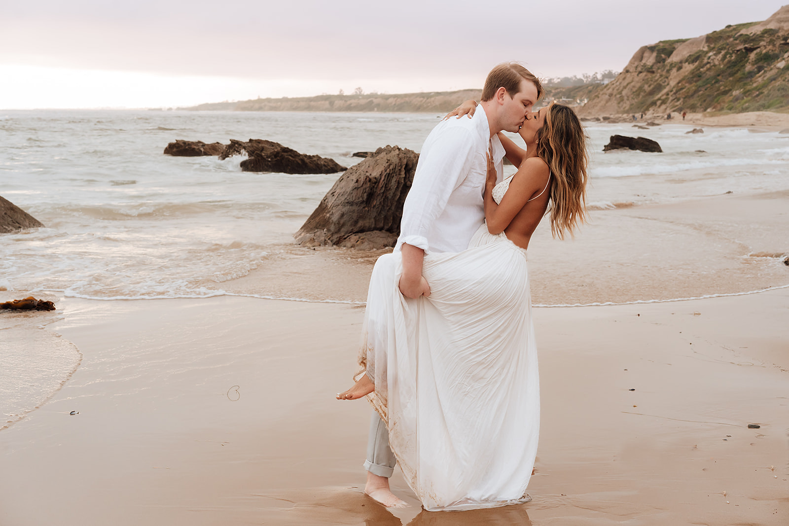 Couple in Orange County California celebrate their engagement with a photoshoot in Crystal Cove State Beach