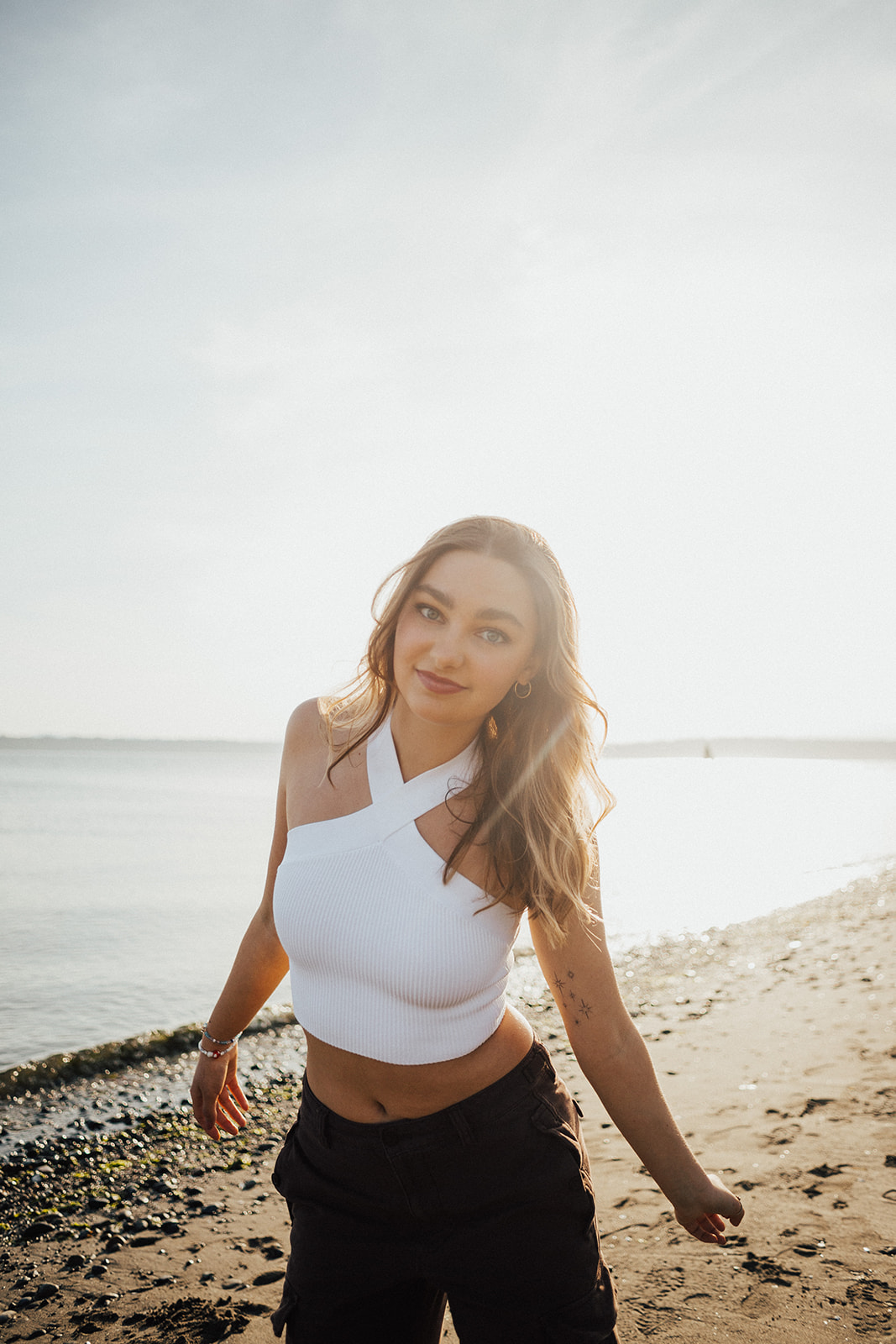 Seattle senior photo session at Discovery Park, golden hour by Hallie Kathryn Photography. Warm, authentic, and natural