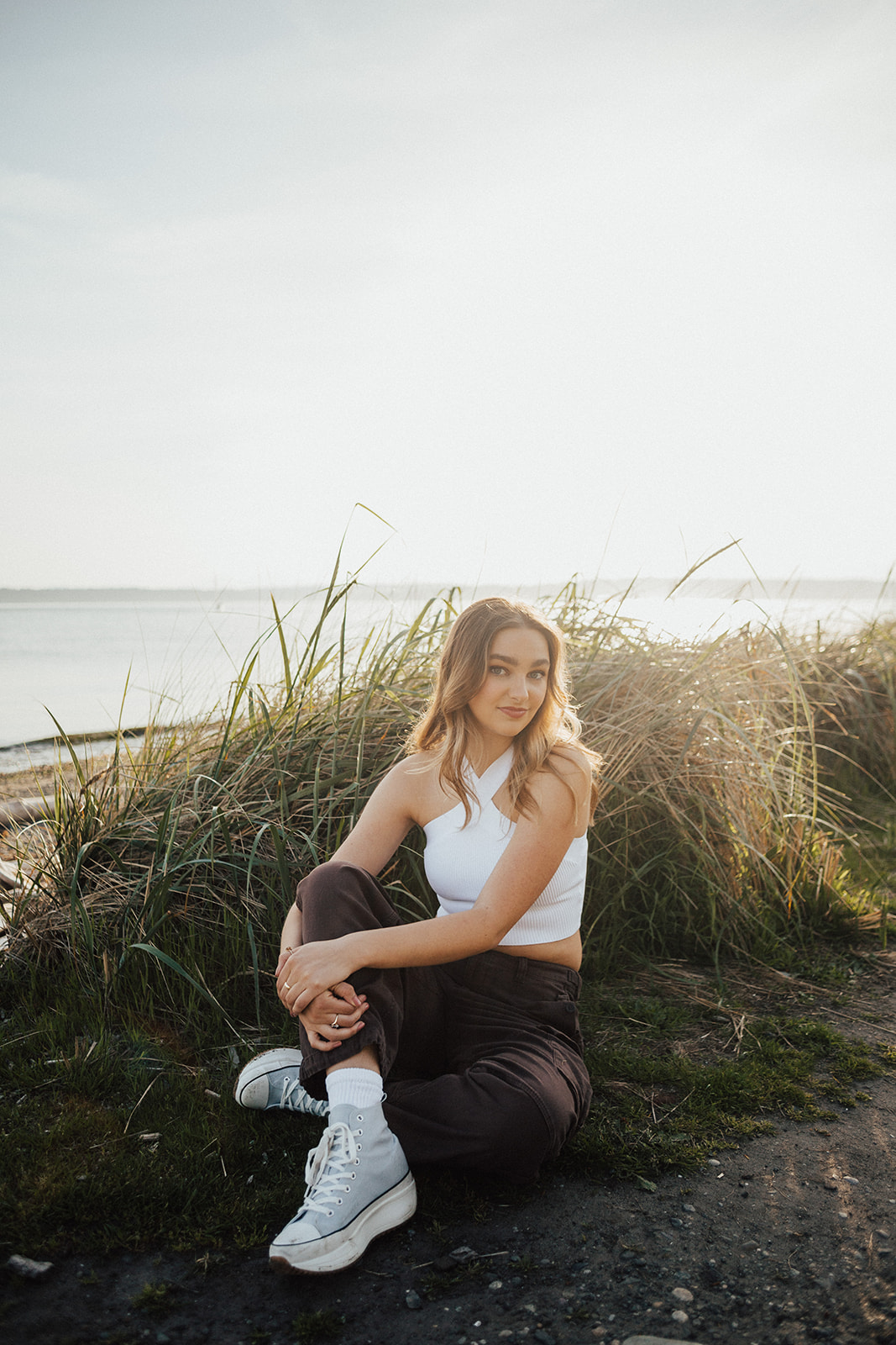 Seattle senior photo session at Discovery Park, golden hour by Hallie Kathryn Photography. Warm, authentic, and natural