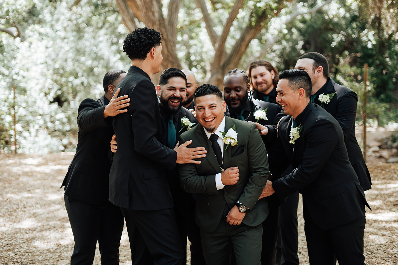 The groomsmen gathered for fun and unposed portraits at this southern california venue Oak Canyon nature center