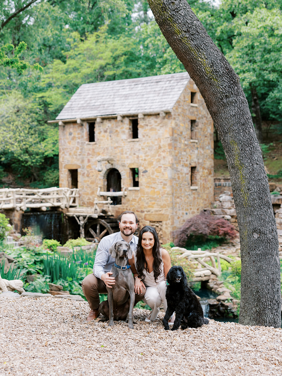 Old Mill engagement photos with couple and their two dogs