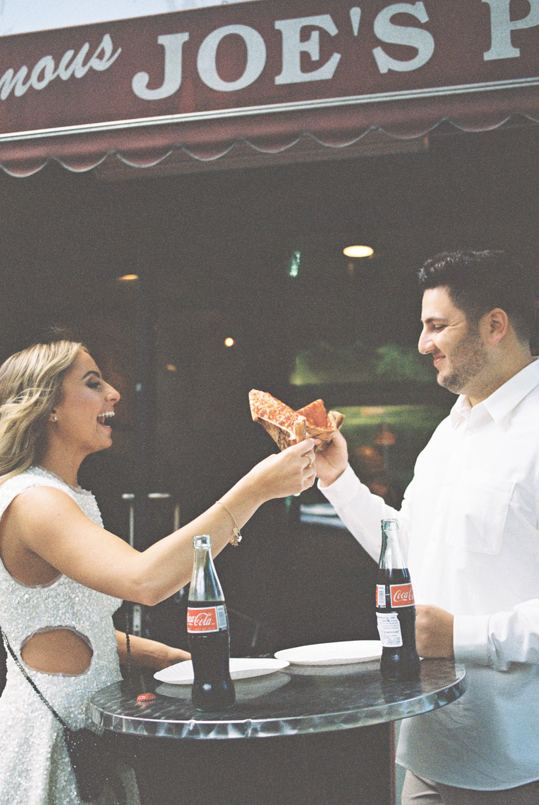 Couple's engagement session at Joe's Pizza in New York City. 