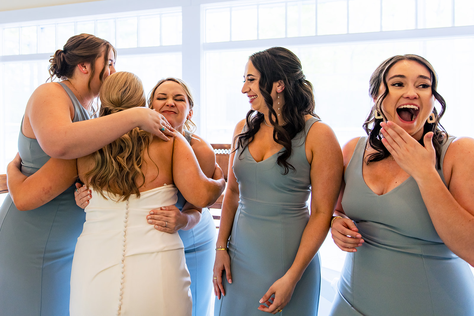 Bride has a first look with her bridesmaids before her wedding at the Camargo Club in Indian Hill