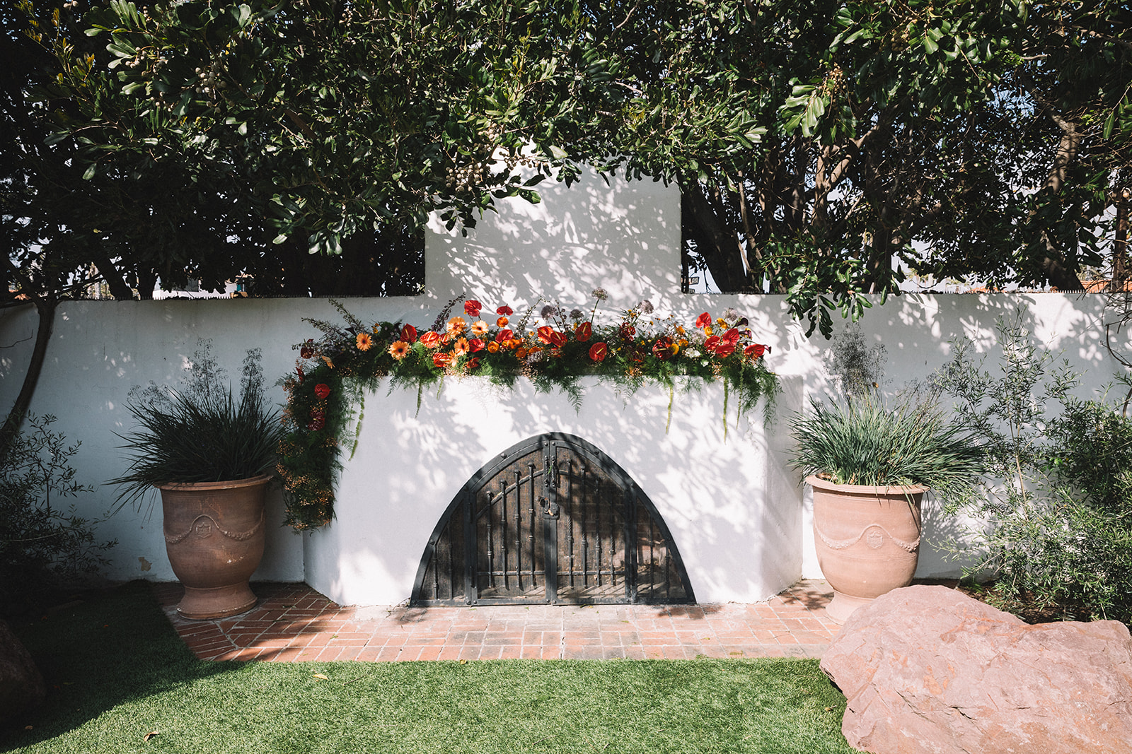 Bright florals were used to make this ceremony alter pop at the Casino San Clemente in Orange County, California. 