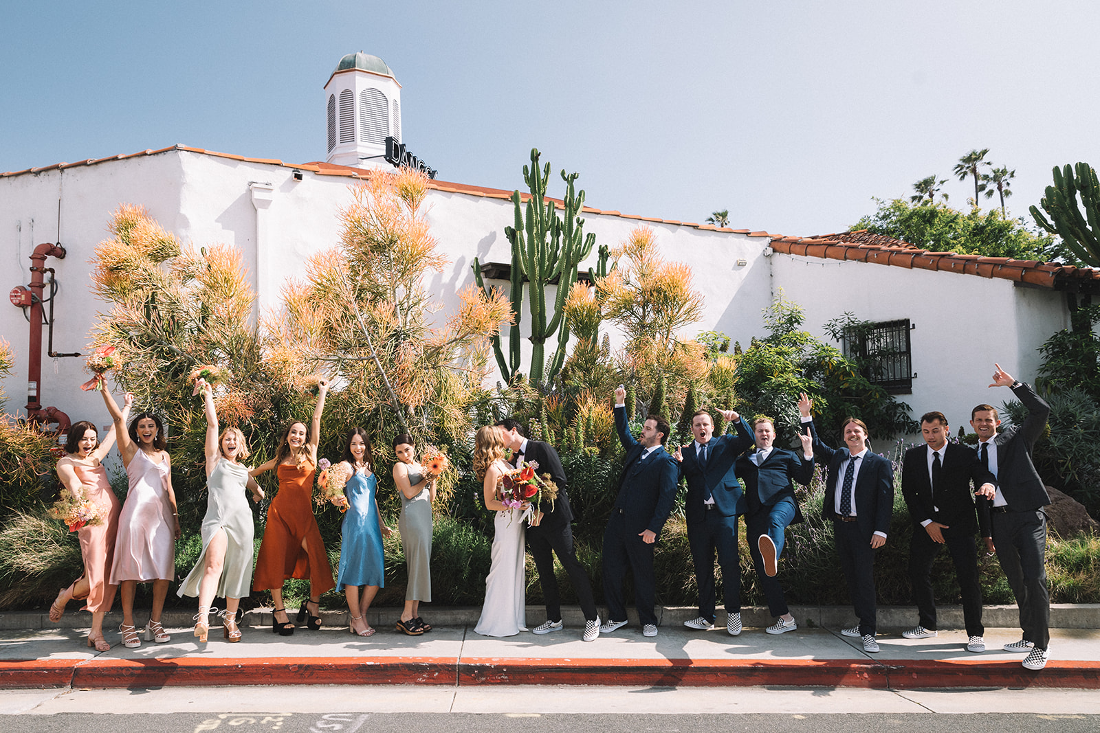 Colorful mix and match bridesmaids dresses were a perfect choice for this summer Orange County, California beach wedding