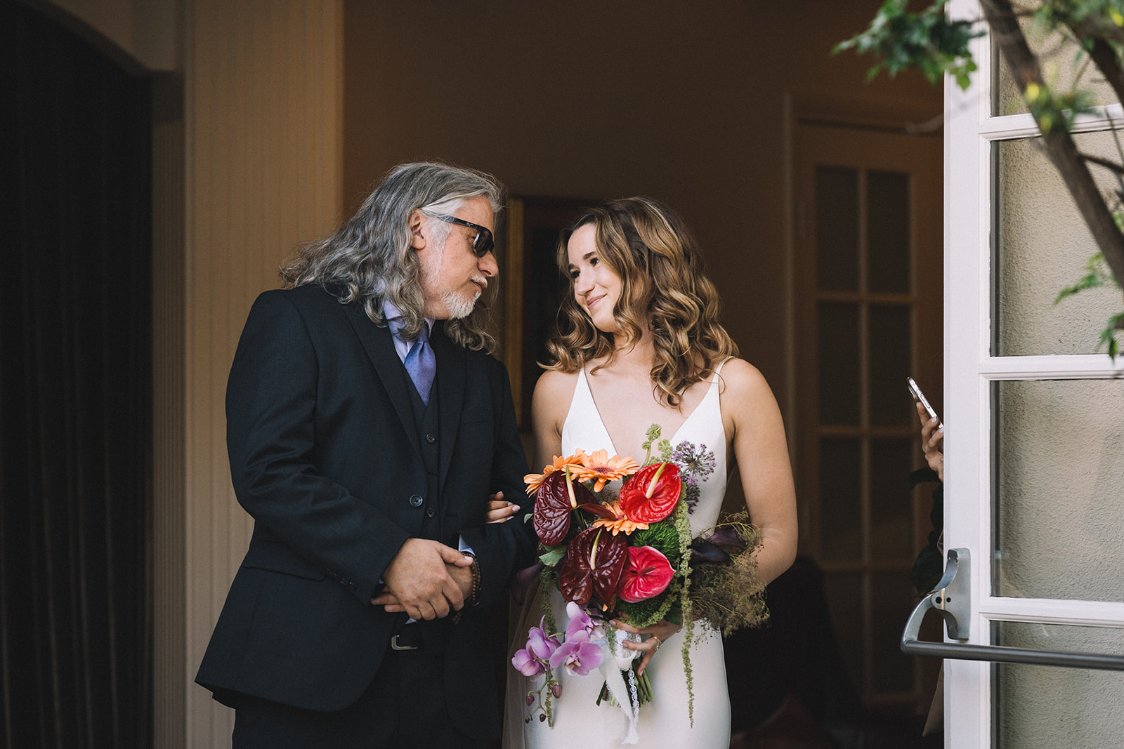 Sweet moments captured with father and daughter before walking down the isle at the Casino San Clemente wedding venue