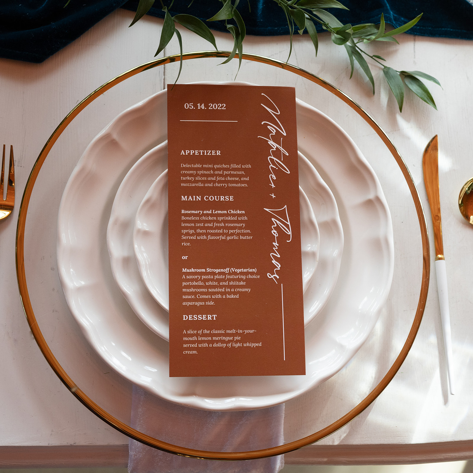 The table setting and menu at the honeymoon table