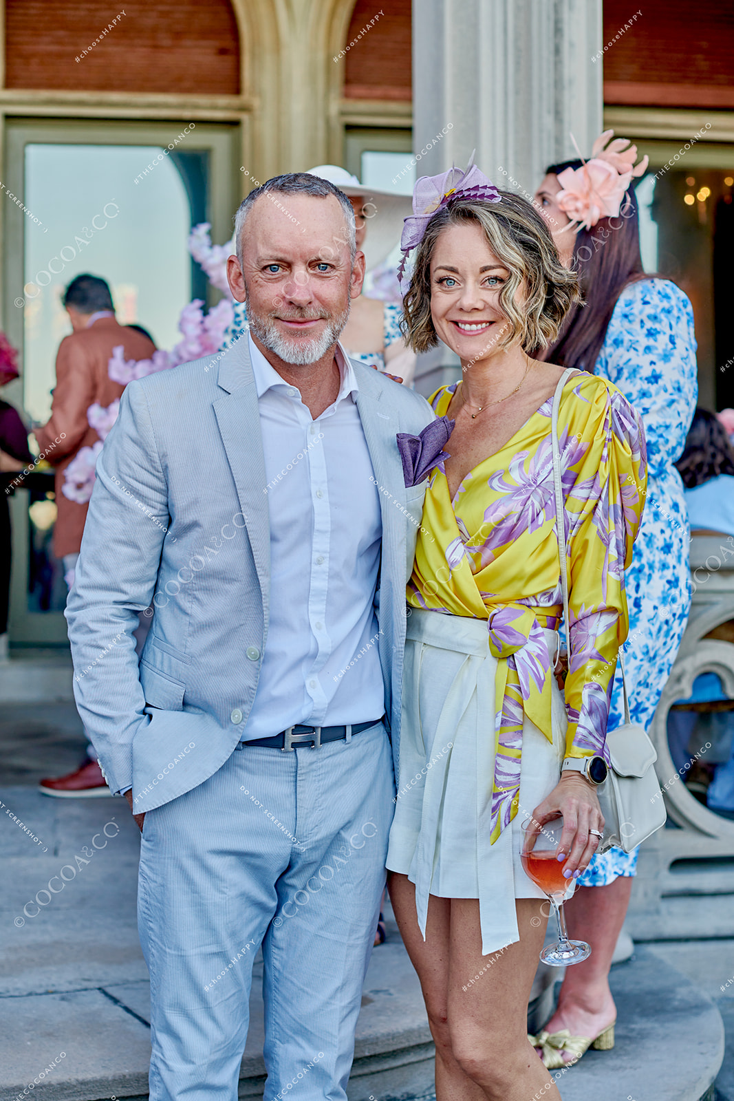 Guests on terrace at Ochre Court Mansion - Newport, RI at Star Kids' 2023 Kentucky Derby Gala captured by Cocoa & Co 