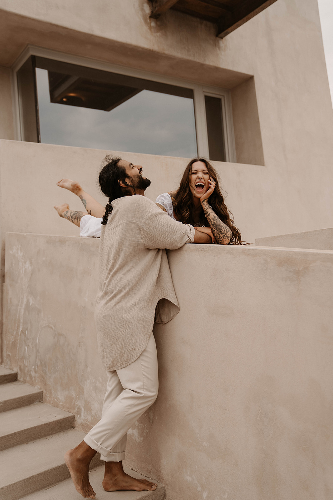 couple lounges together on their Santorini Elopement 