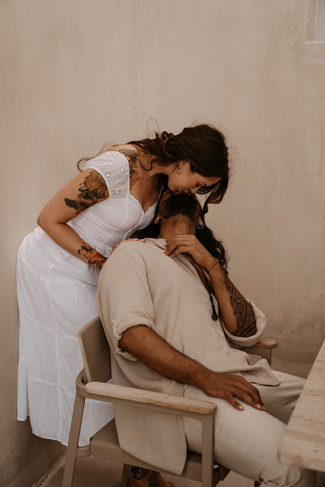 A couple relaxing together on their elopement day in Santorini Greece