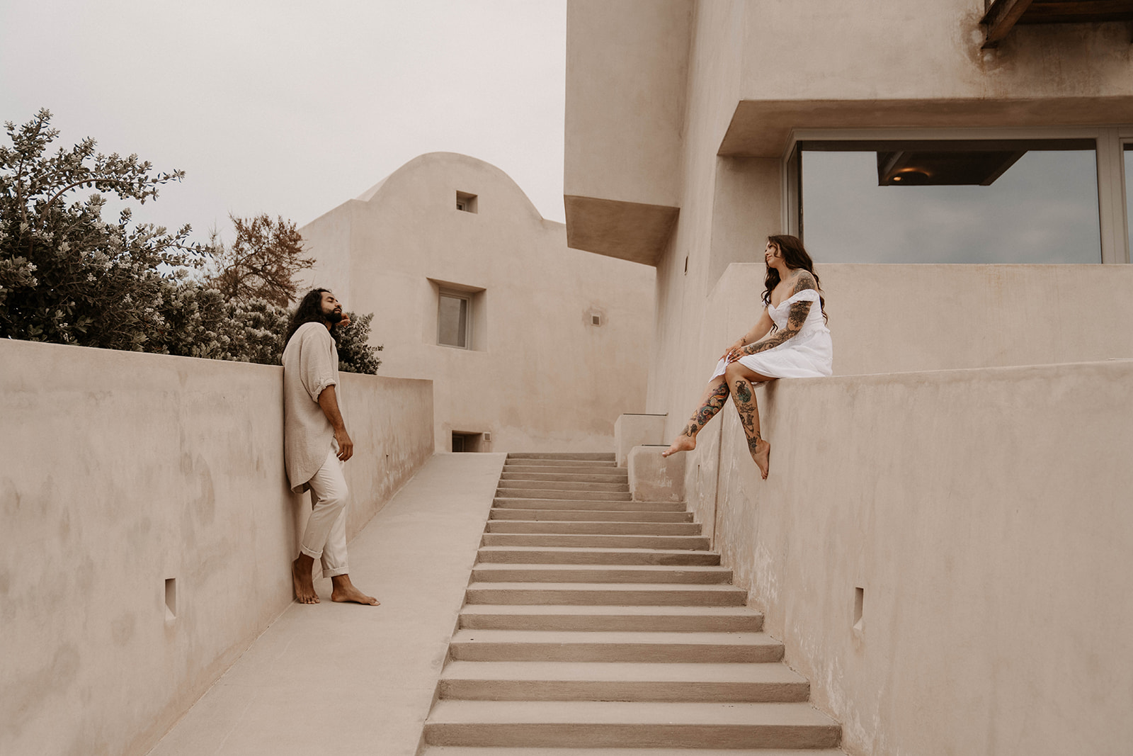 Playful moments between a couple in Santorini Greece