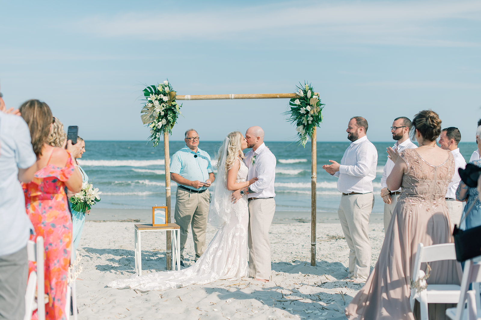 bride and groom first kiss on the beach at shipyard plantation on Hilton head island in South Carolina 
