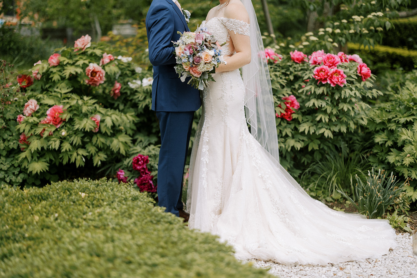 couple embrace on their wedding day at allen centennial gardens in madison wisconsin
