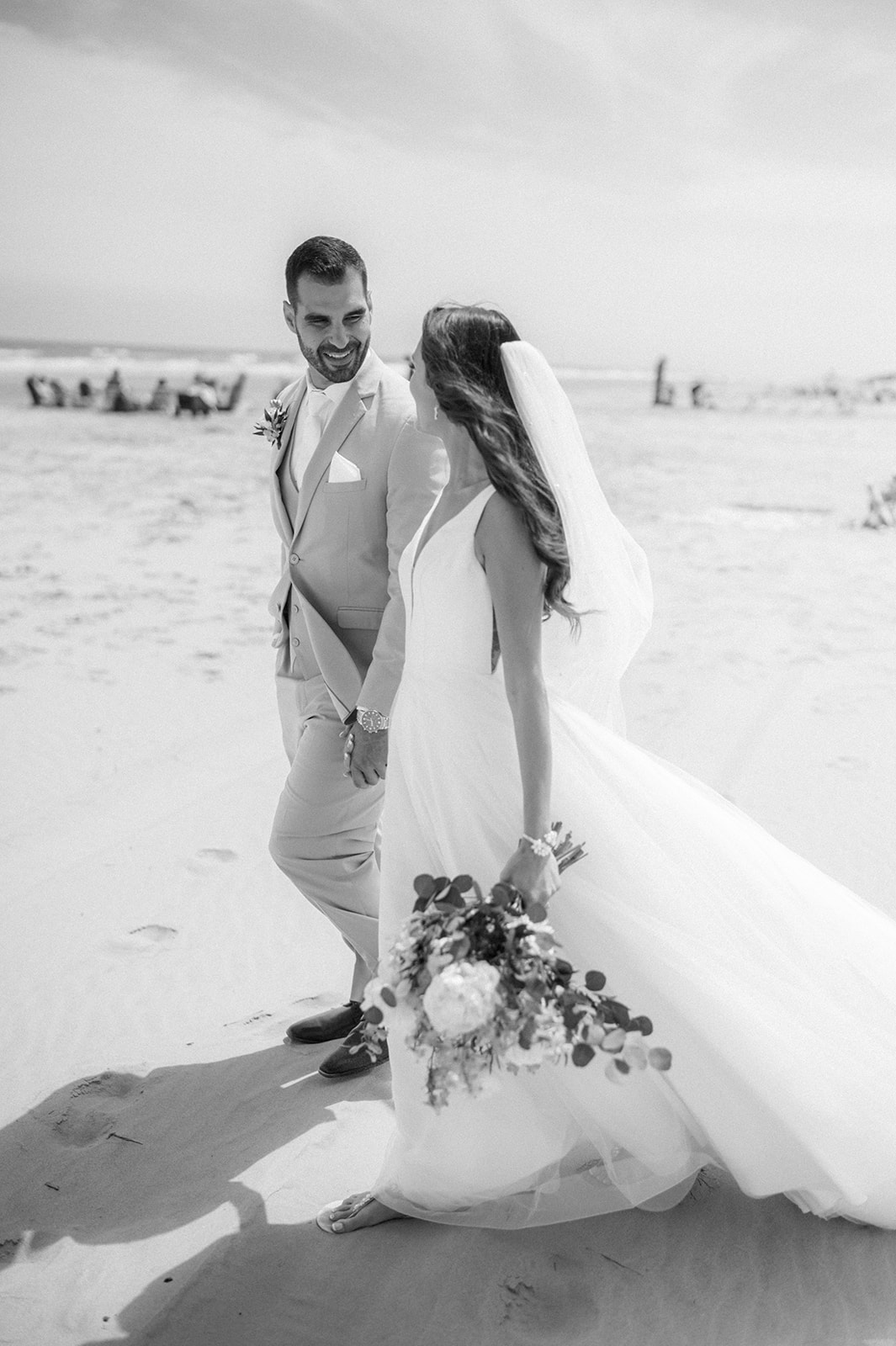 Bride and groom beach portraits at Icona Avalon Wedding