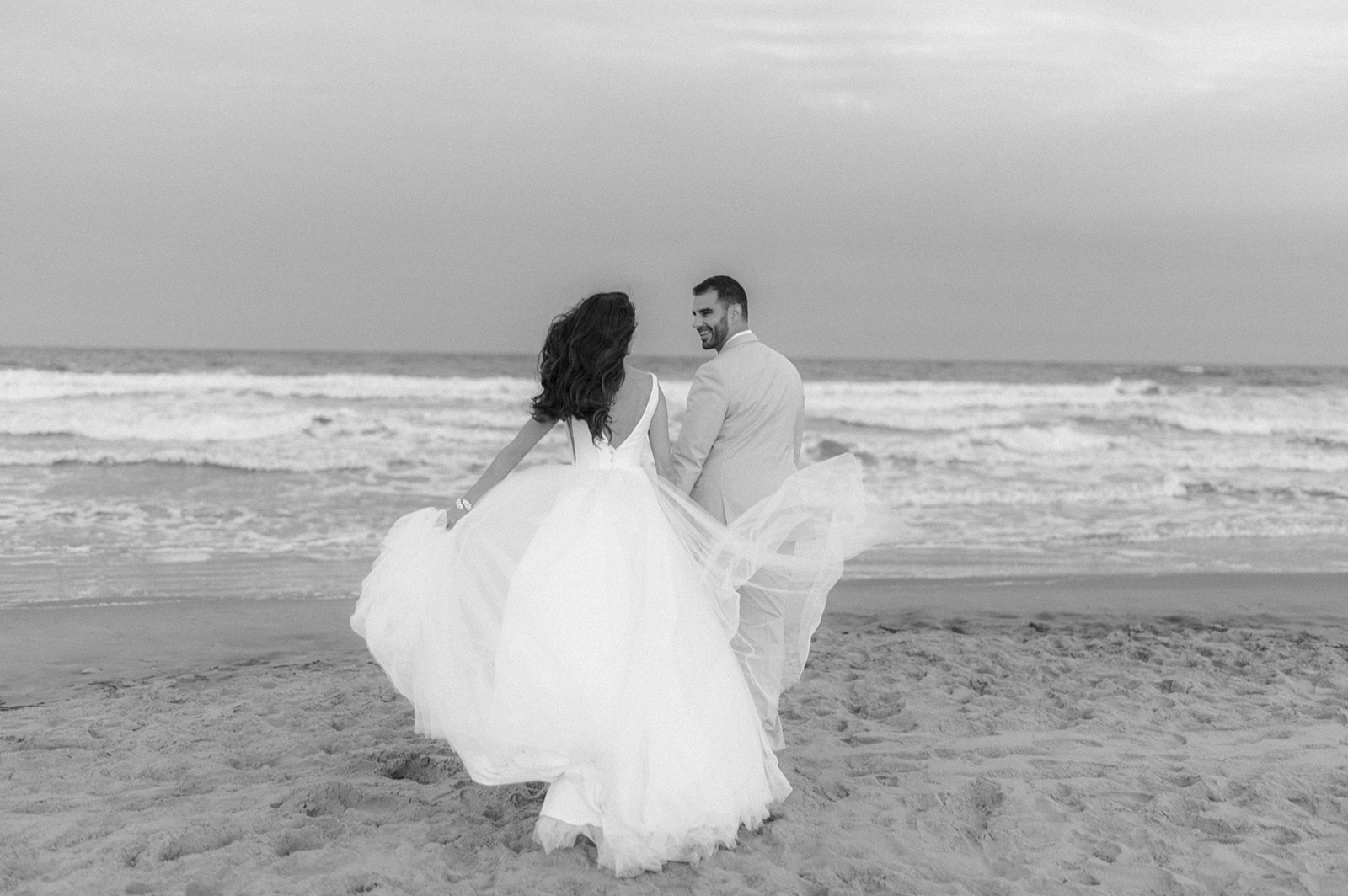 Bride and groom beach sunset portraits at Icona Avalon Wedding