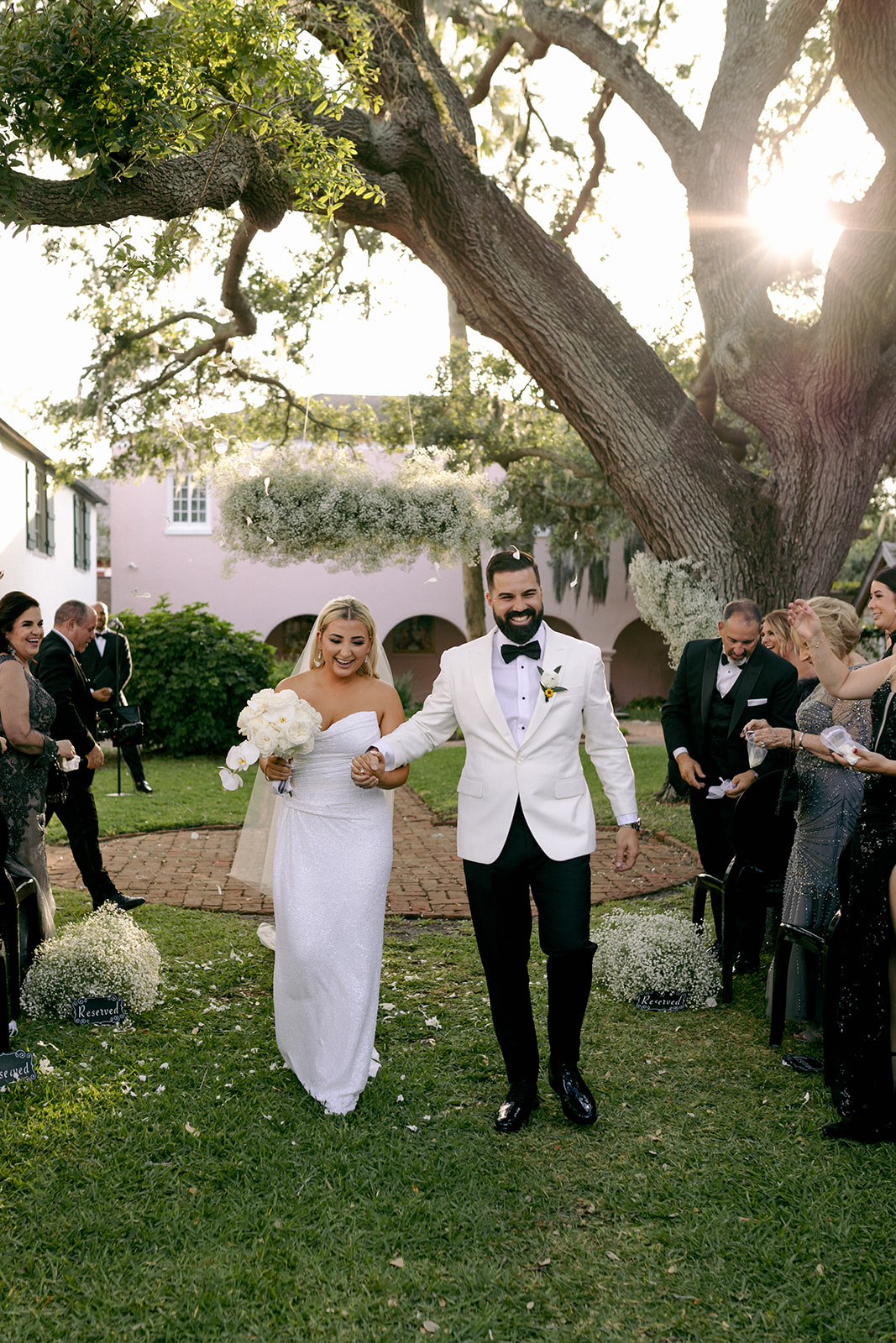 newlywed couples walking down the aisle Oldest House wedding ceremony in St Augustine FL