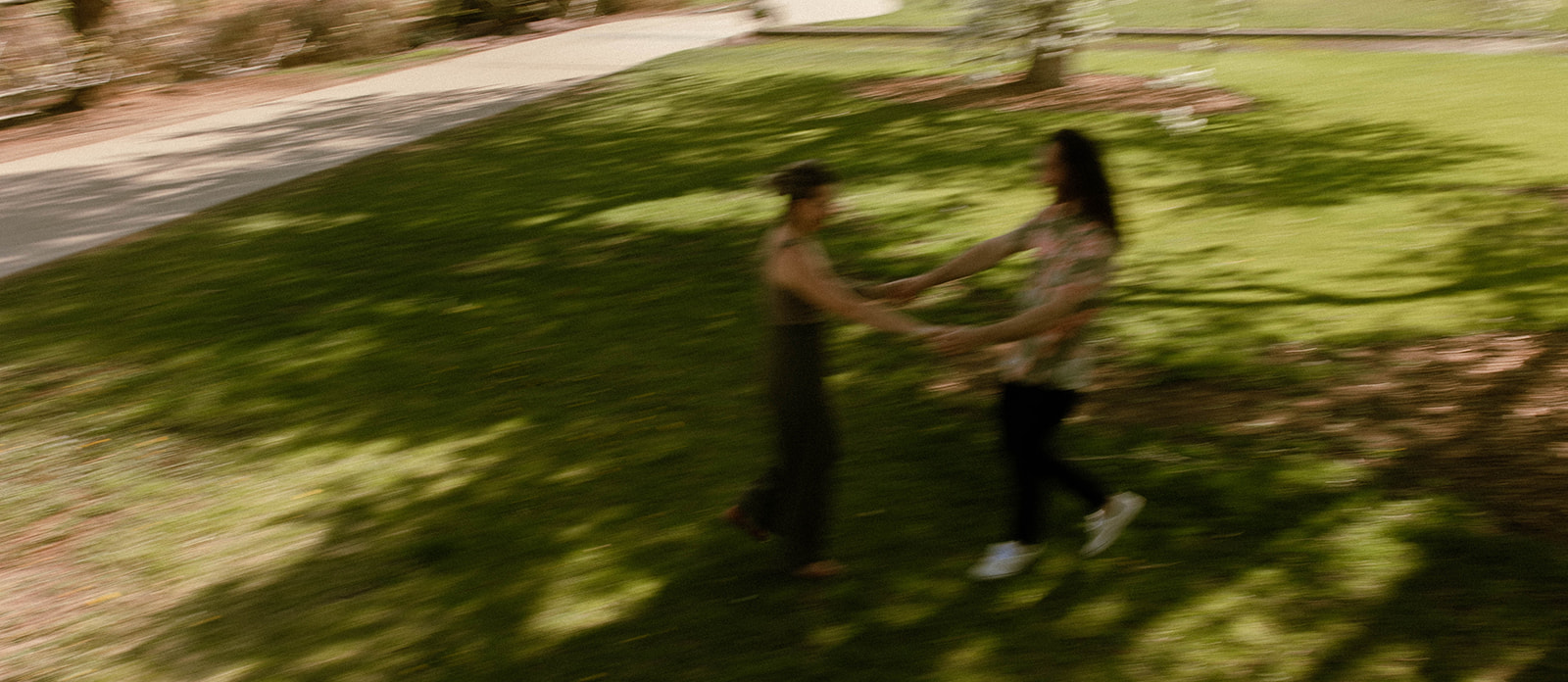 couple spinning in the park