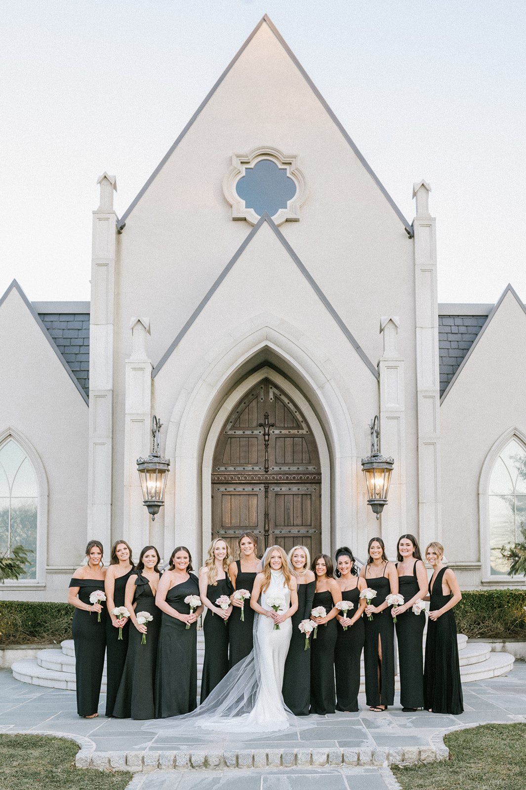 bridesmaids in front of park chateau chapel