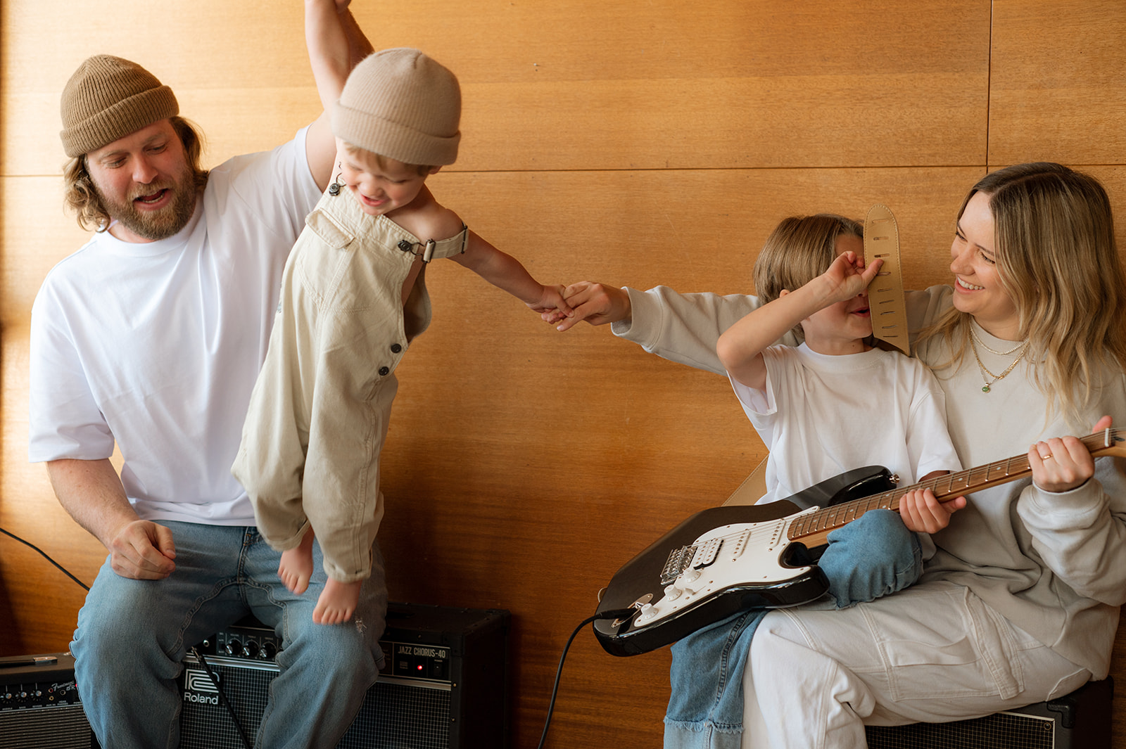 whole family play guitar in living room portraits Provo utah