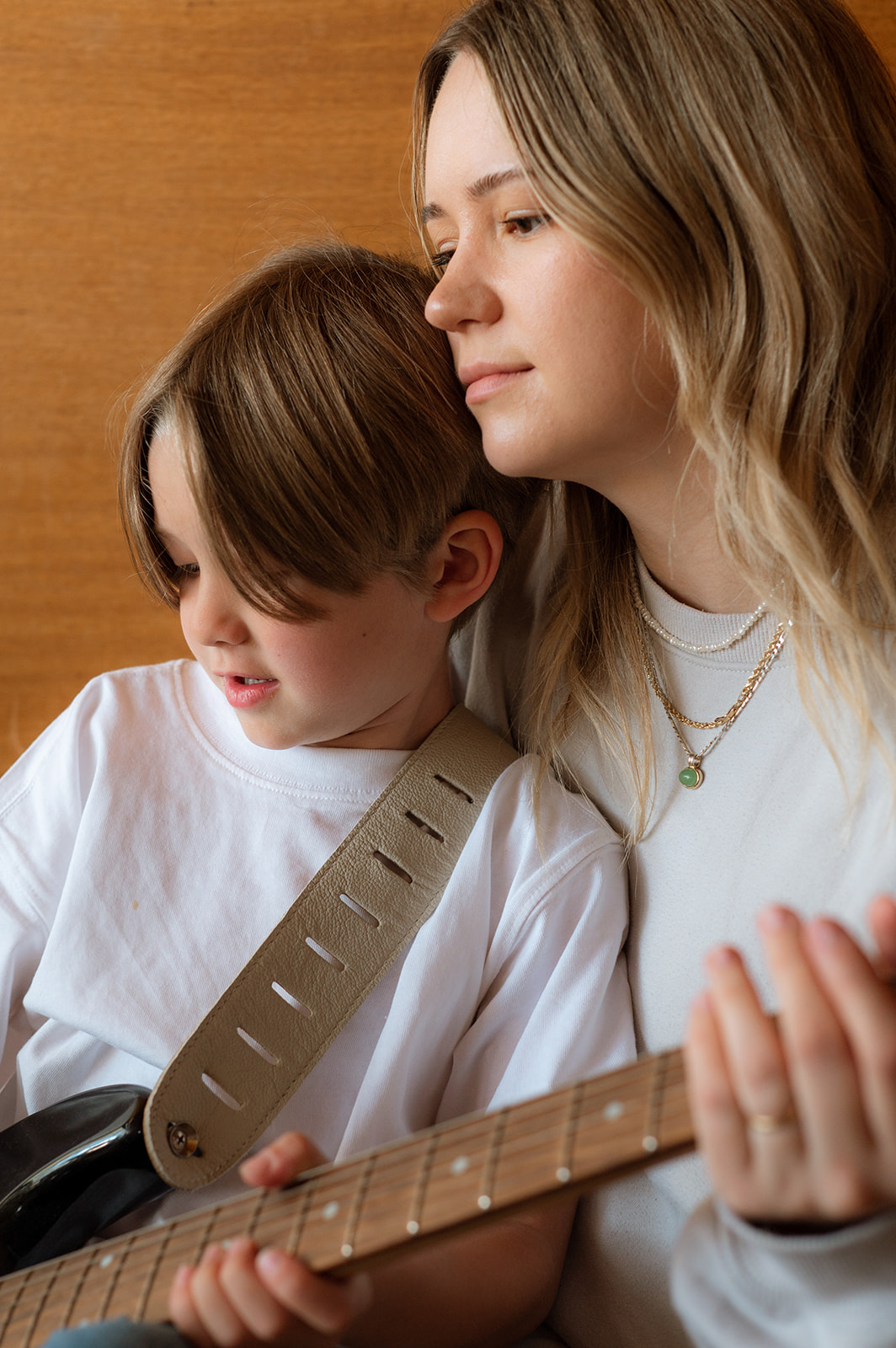 Mom and son play guitar together