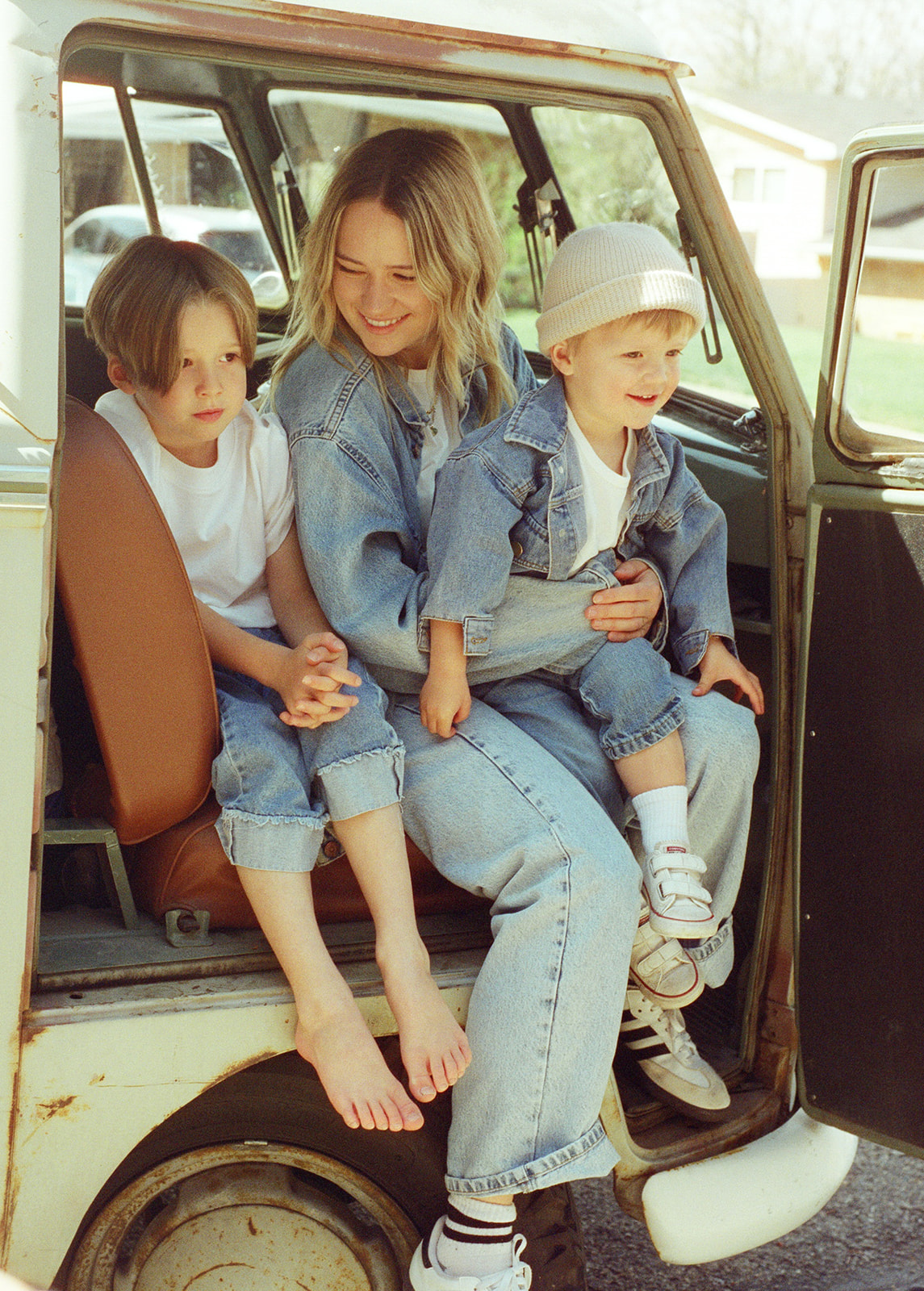 film portrait mother and sons sit together in front seat of VW truck in portrait session in Provo Utah