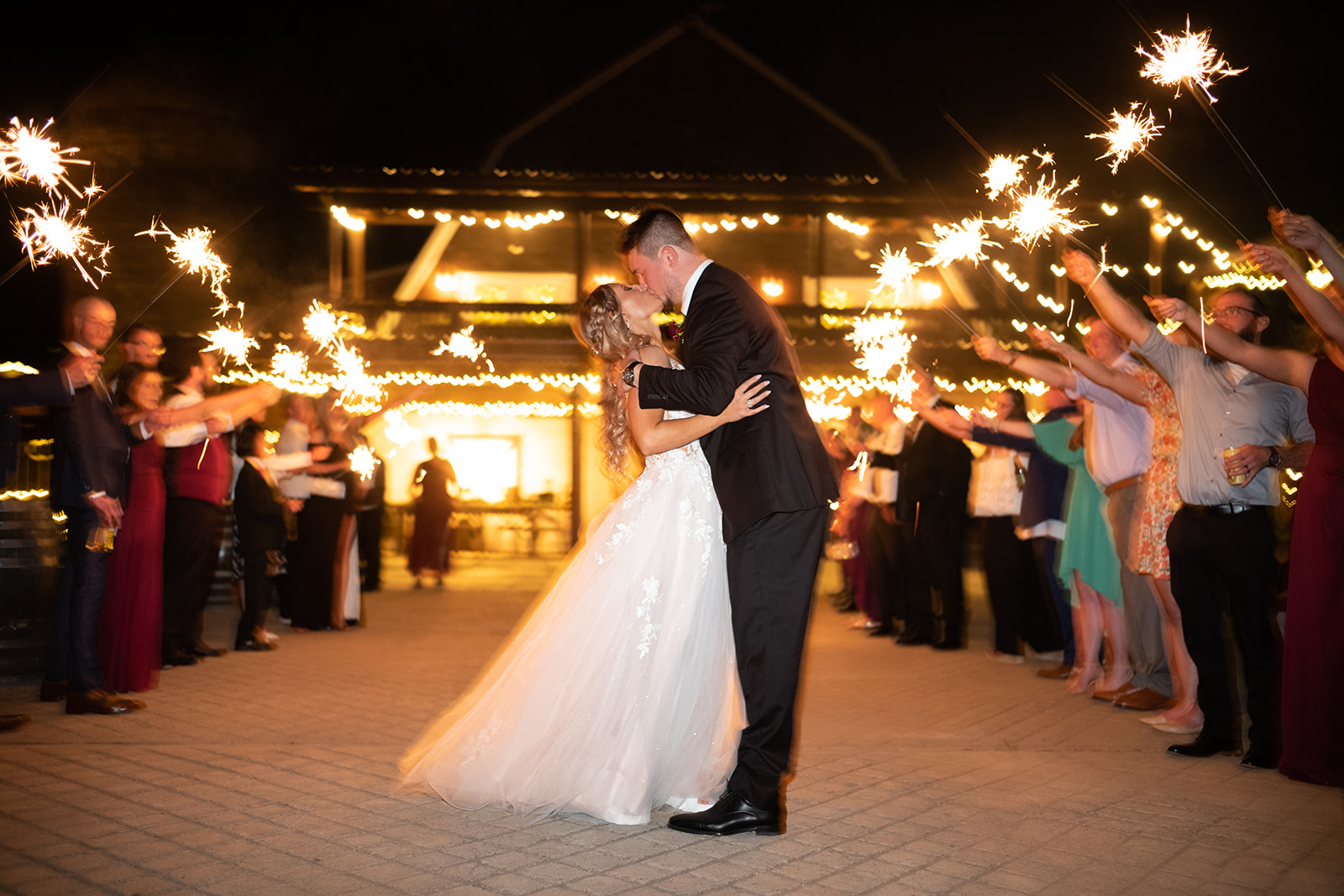 couple kissing with sparkler display