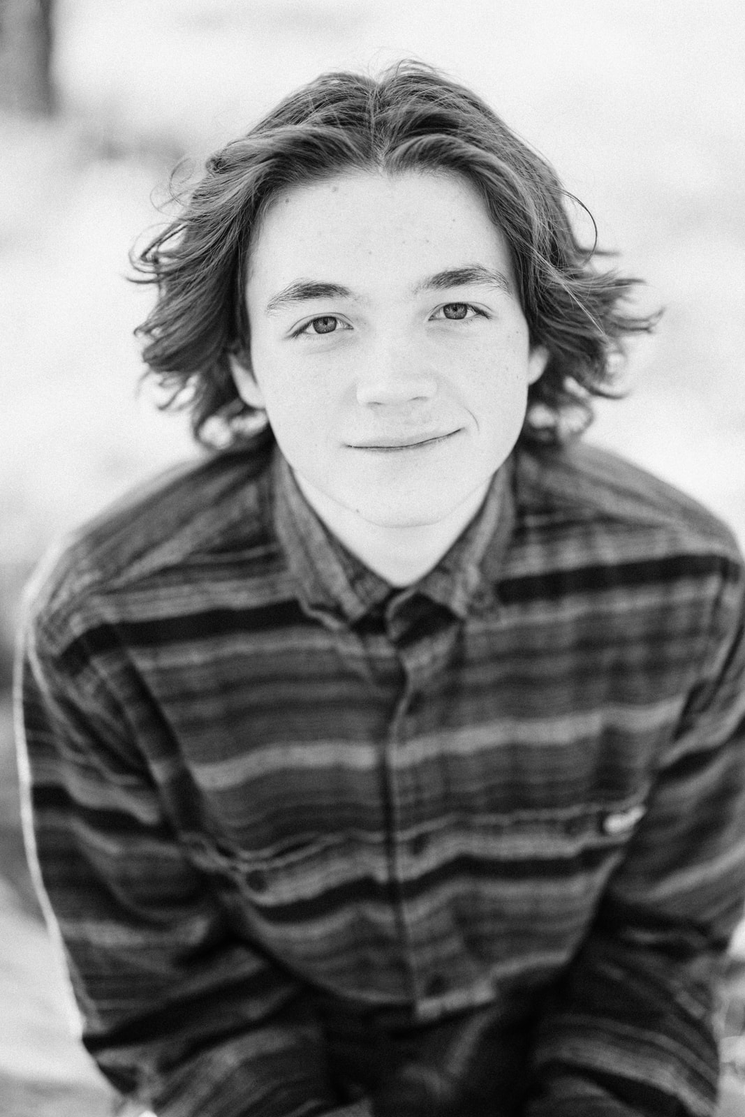 Portrait of senior boy in black and white