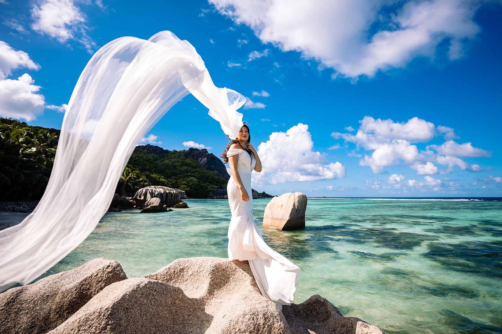 Wedding photography of a beautiful wedding on Anse Source d'Argent beach, La Digue, Seychelles. 