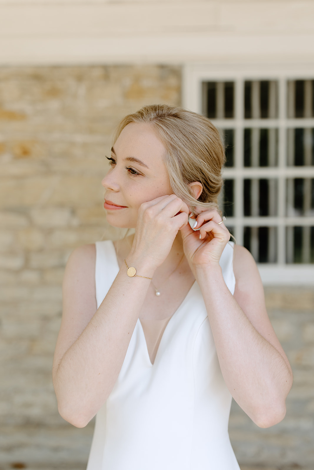 Bride puts in earrings