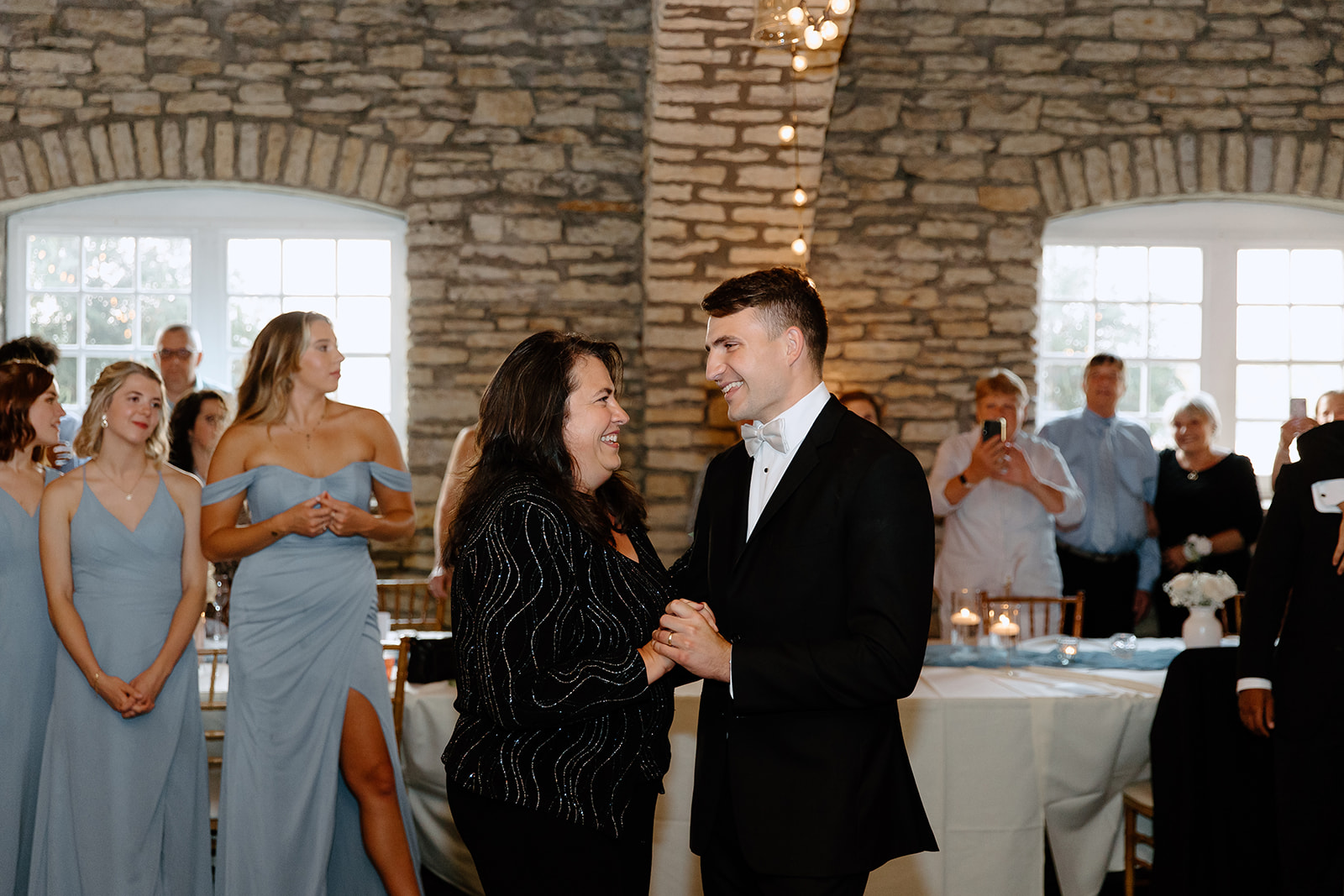 Groom and his mom dancing