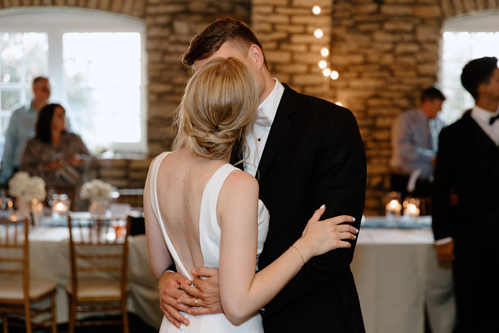 Bride and groom kissing on dance floor