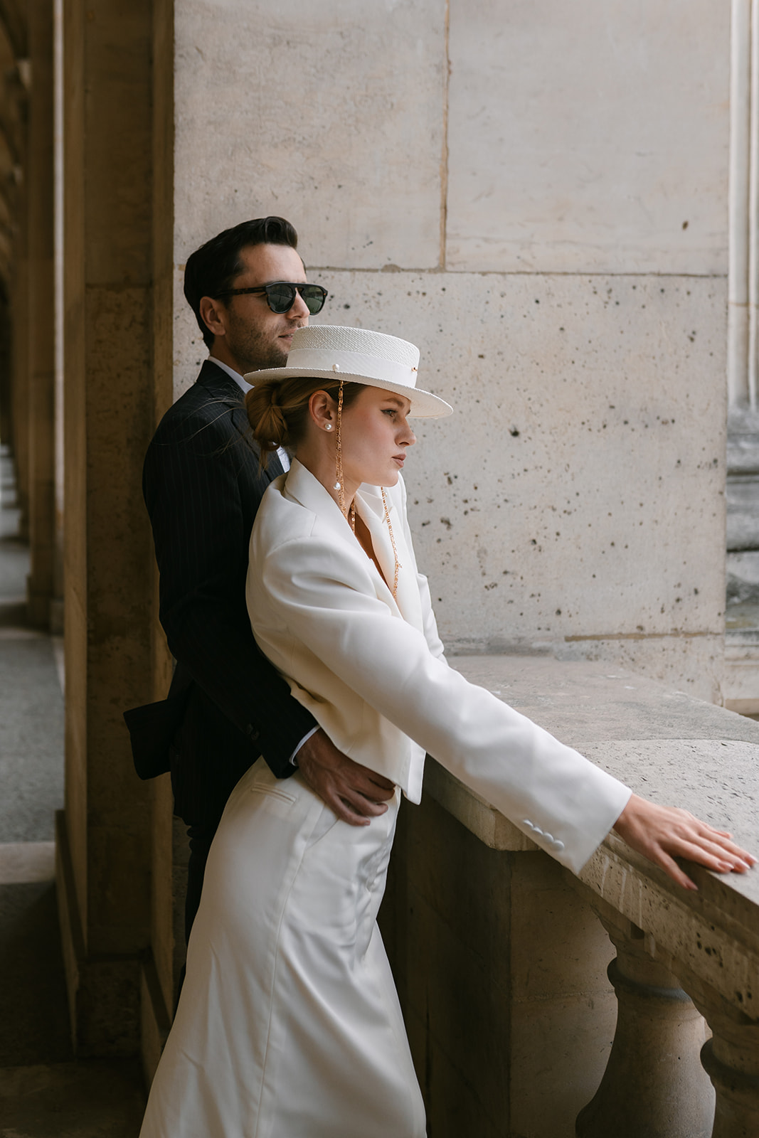 Sophisticated elegant french couple walking at the louvre in Paris