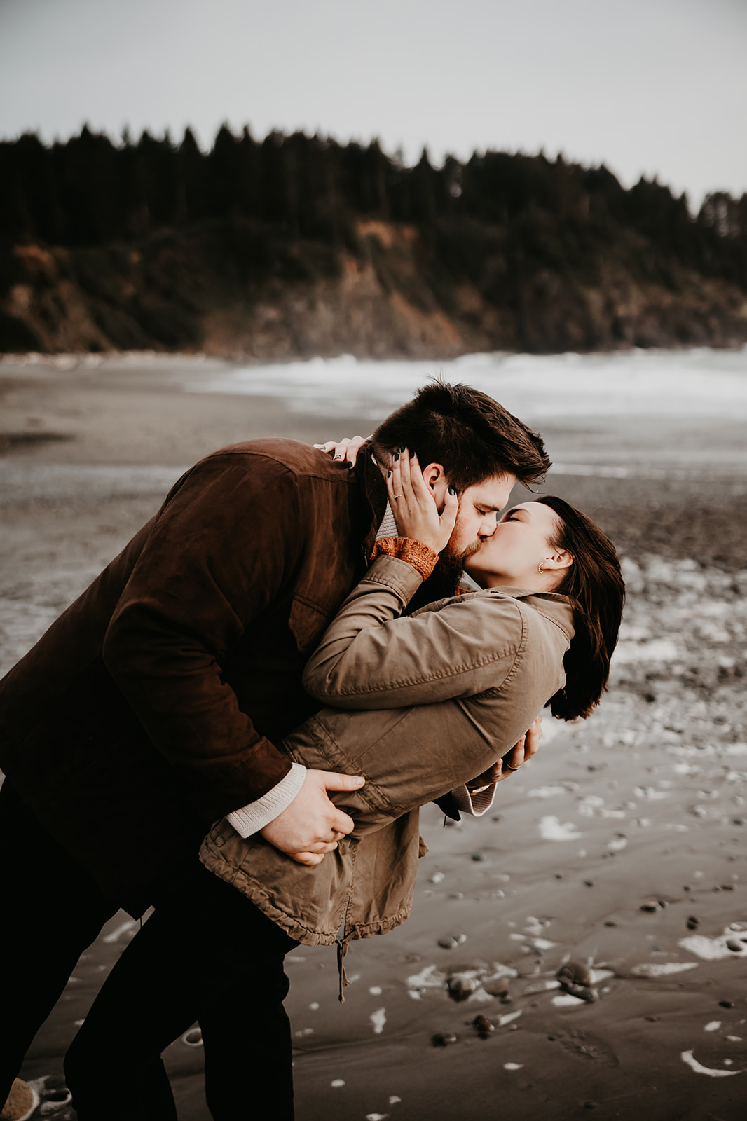 Romantic couple embracing at La Push Beach engagement session