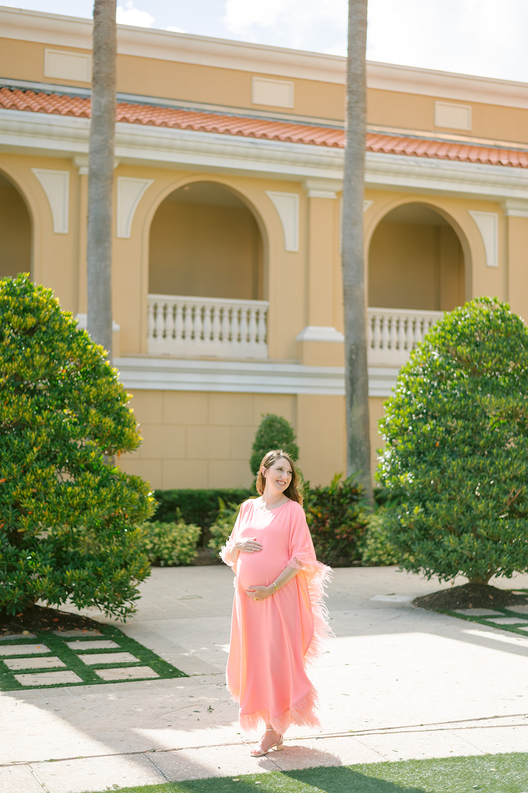 Amanda's journey into motherhood captured in a green dress at The Ritz Carlton