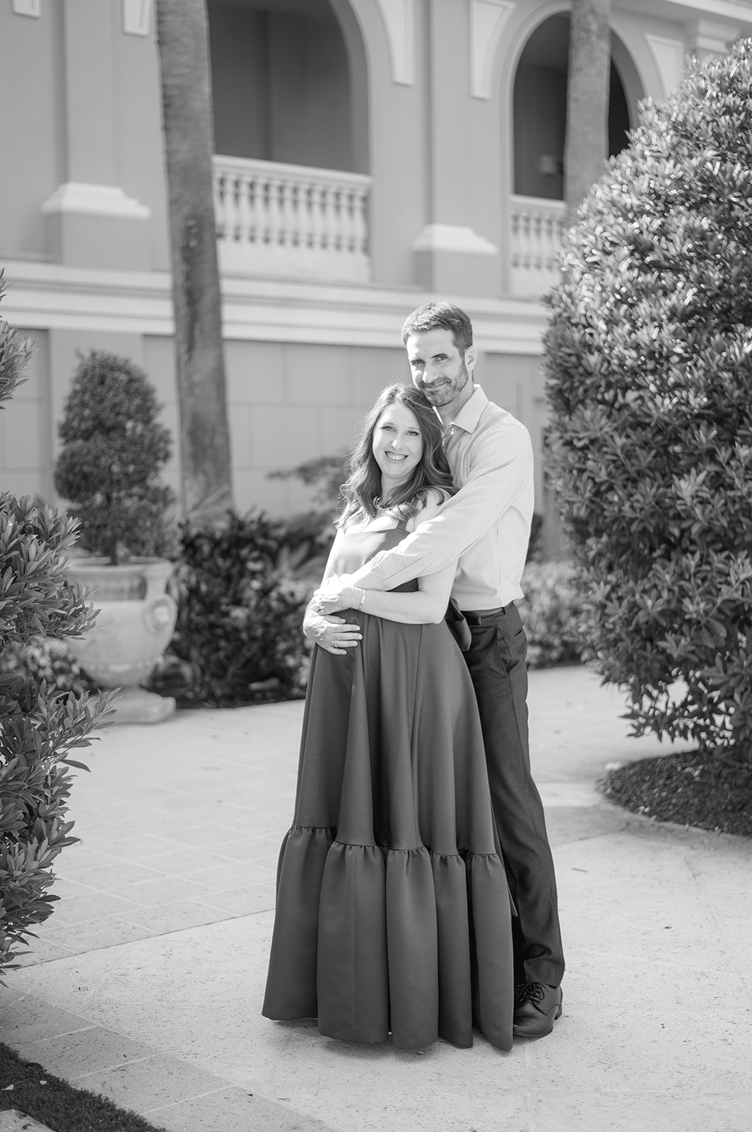Hernan capturing Amanda's beautiful pregnancy journey in a green dress at The Ritz Carlton