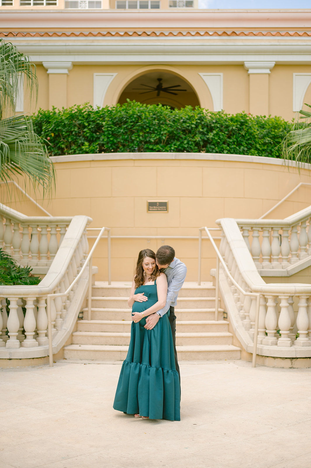 Joyful maternity moments with Amanda in a green dress at The Ritz Carlton