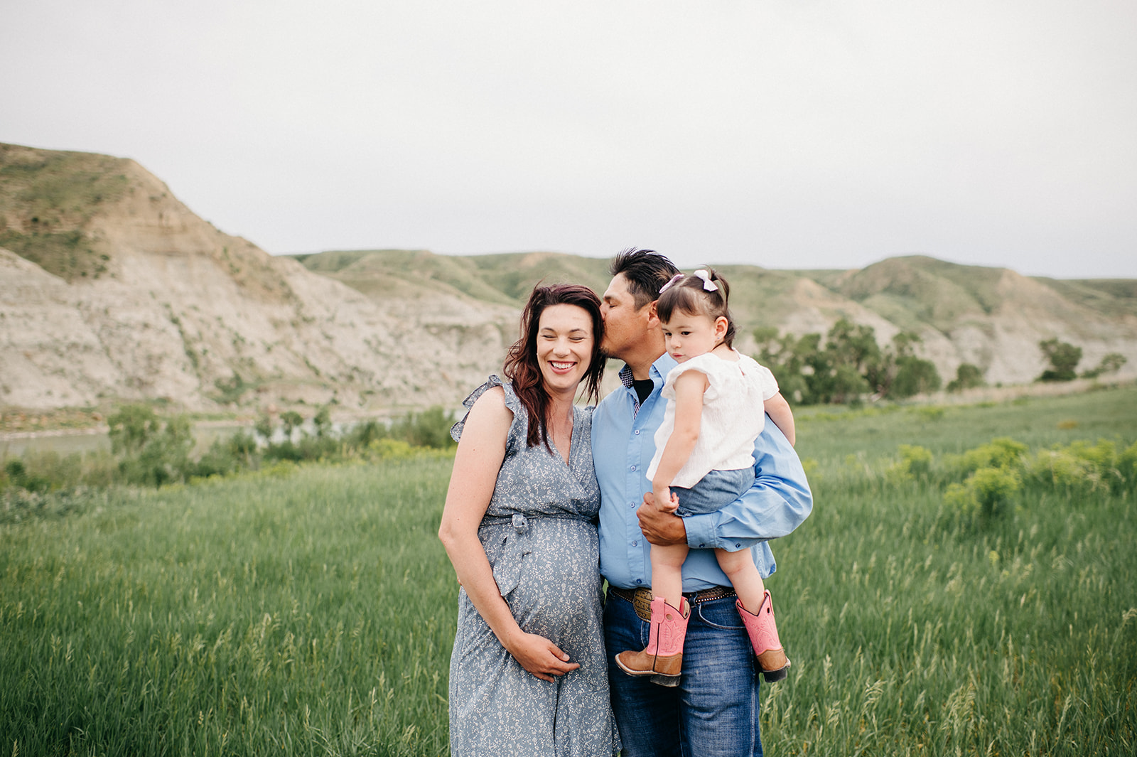 a young family of three create beautiful maternity photos in Lethbridge Alberta