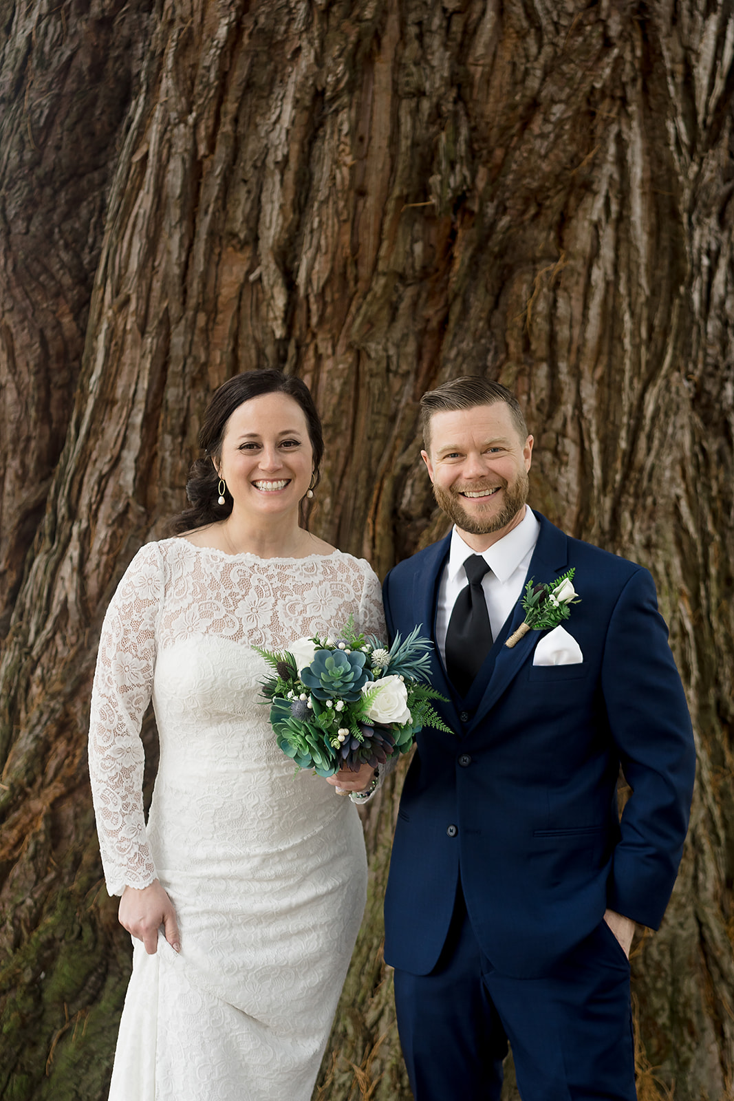 bride and groom smile for portrait at port gamble wedding